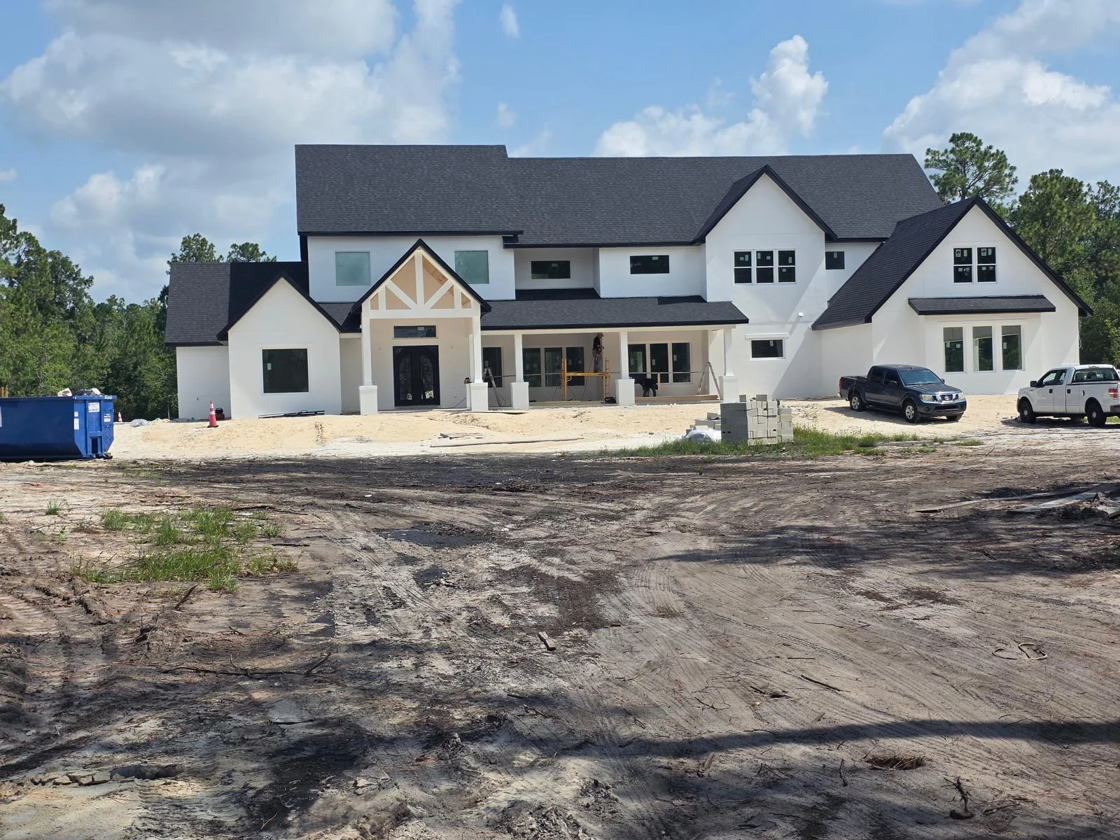 Finished custom home exterior awaiting final landscaping