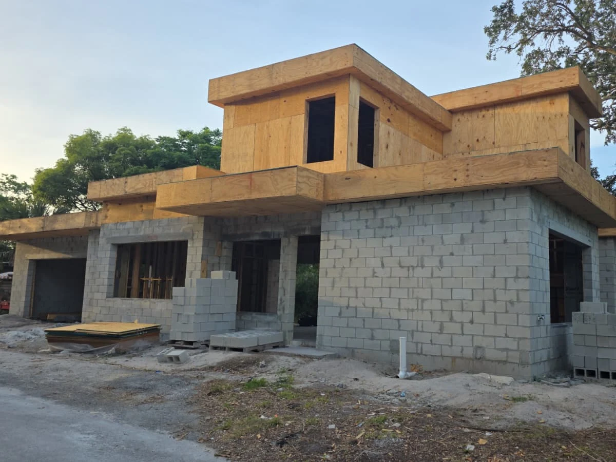 Complete structural wood framing for a custom two-story residence, showcasing precision craftsmanship, structural integrity and attention to architectural detail.