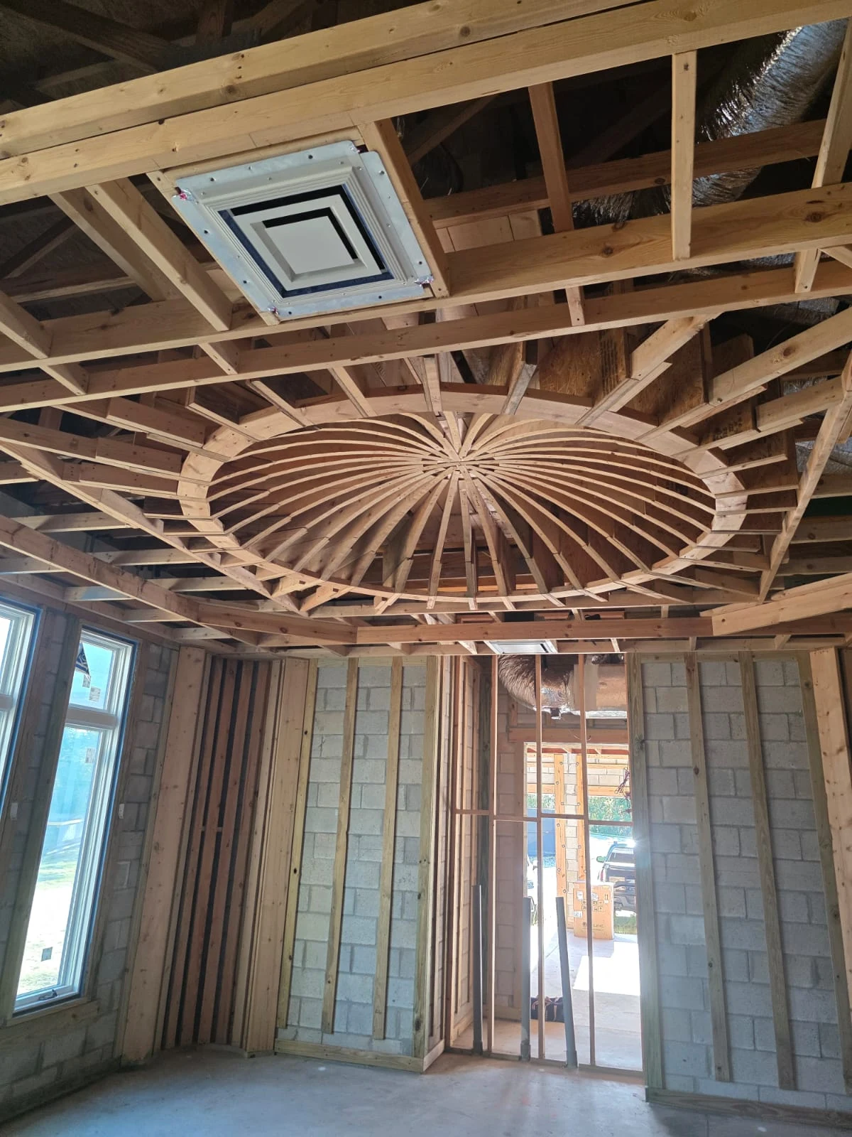 Detailed custom ceiling framing demonstrating advanced craftsmanship and structural precision